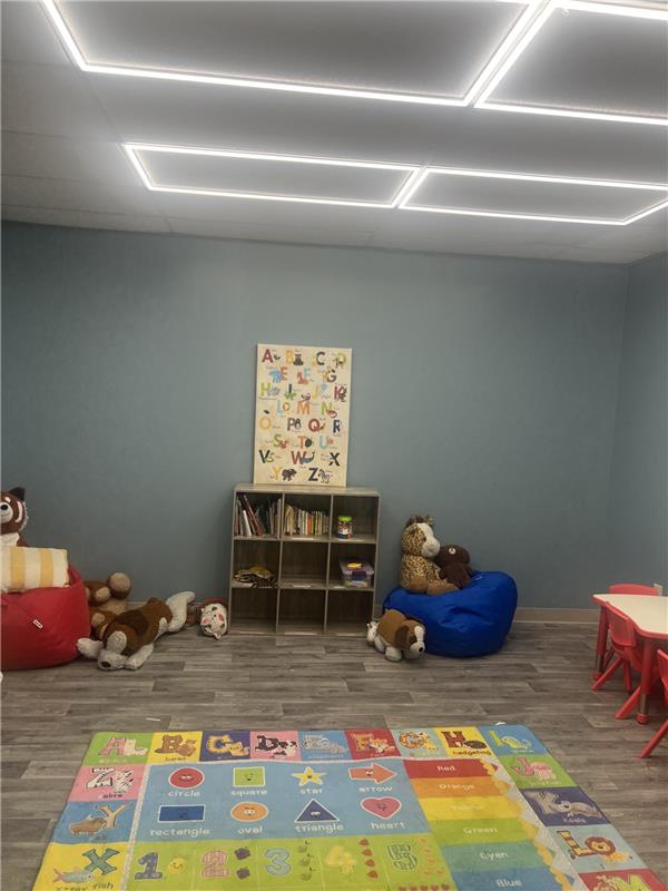 ABT reading nook with stuffed animals and alphabet poster